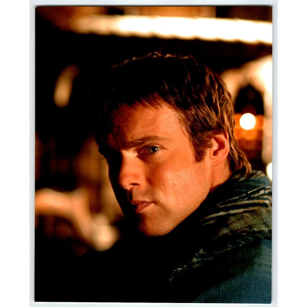 2000s Press Photo Close-Up Portrait of Man in Dim Light Interior